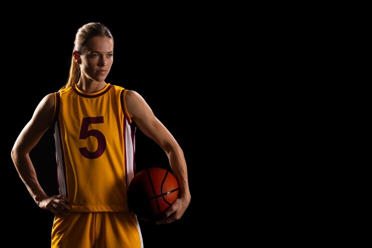 young-caucasian-female-basketball-player-poses-basketball-uniform-black-background-with-c_13339-360847